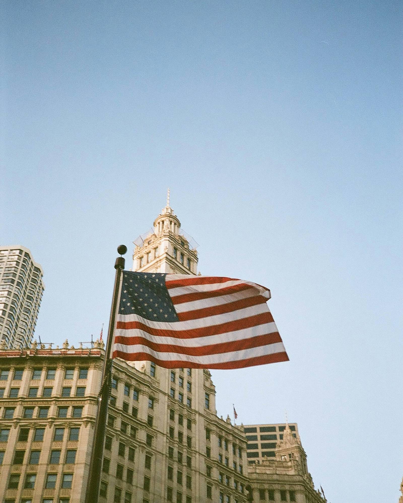 American flag in front of a historic downtown building